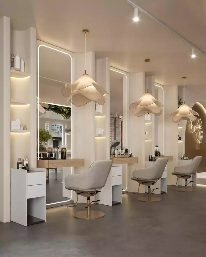 the interior of a hair salon with chairs and lights