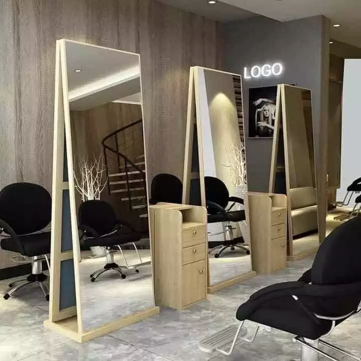 a hair salon with mirrors and chairs in it