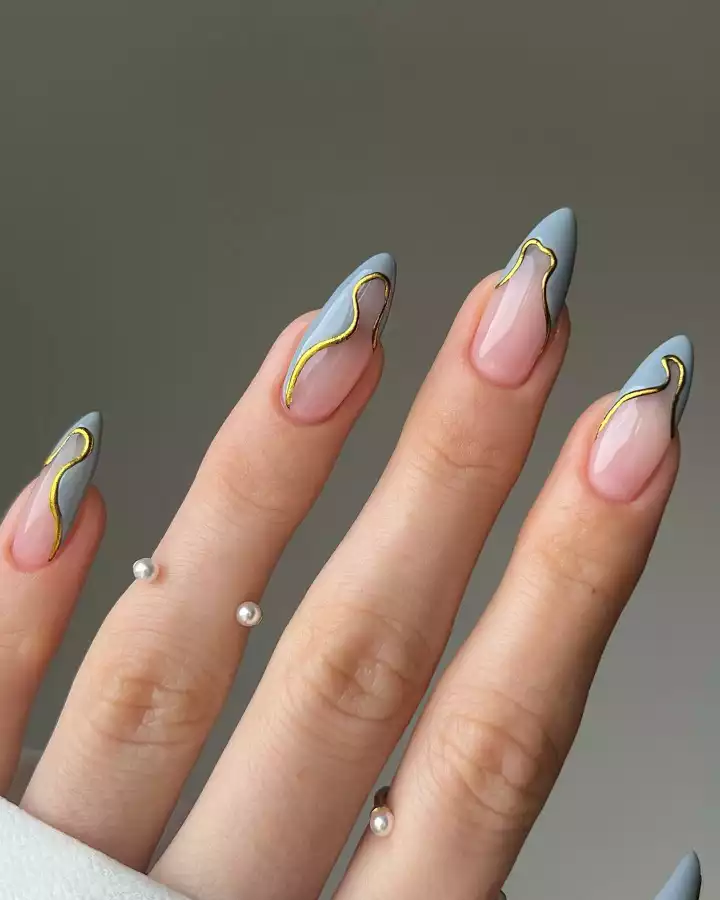Gold and white nail art